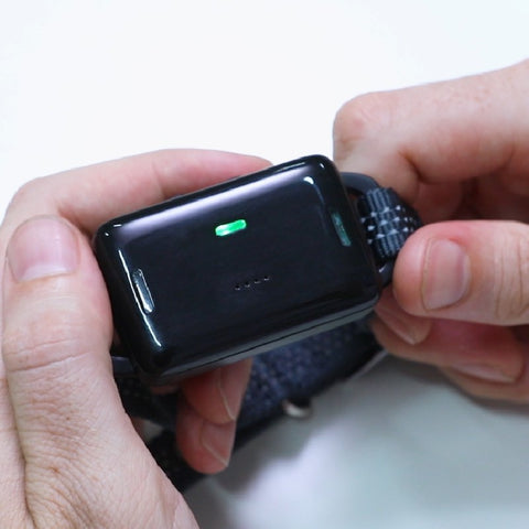 Close-up of hands adjusting the Enhanced 3-in-1 Retractable Dog Leash with Built-In Waste Bag Dispenser.