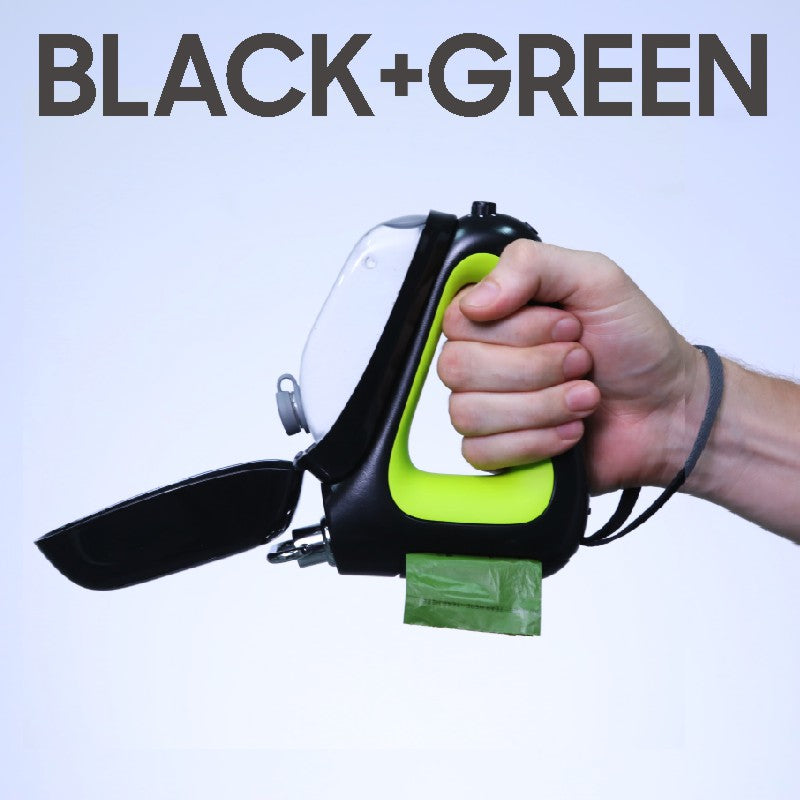 Enhanced 3-in-1 retractable dog leash in black and green with built-in waste bag dispenser, shown in hand.