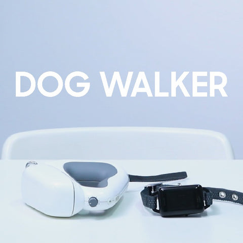 Modern dog walker device with leash and collar on white table.